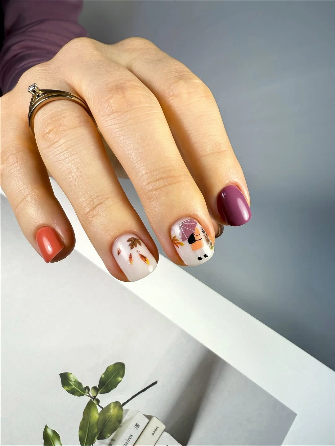 short fall nails with red orange mauve and tiny leaf art