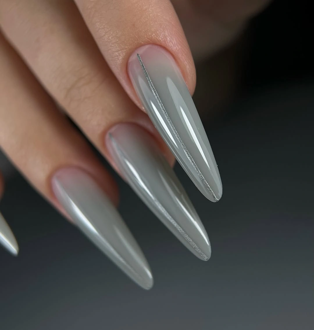 long smoke gray stiletto nails with glossy pointed tips