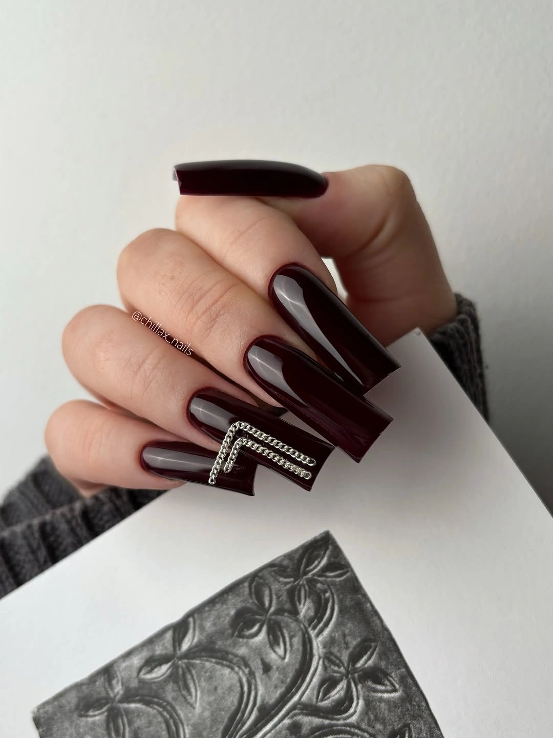 long dark cherry square nails with glossy reflective finish