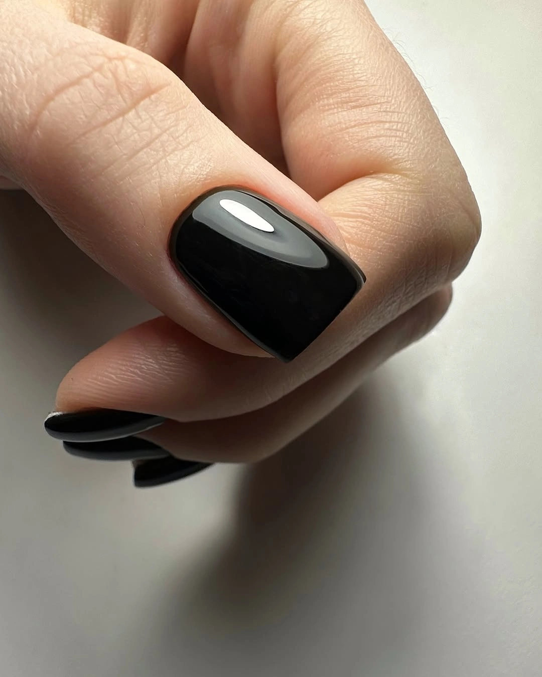 glossy black short square nails with rounded corners