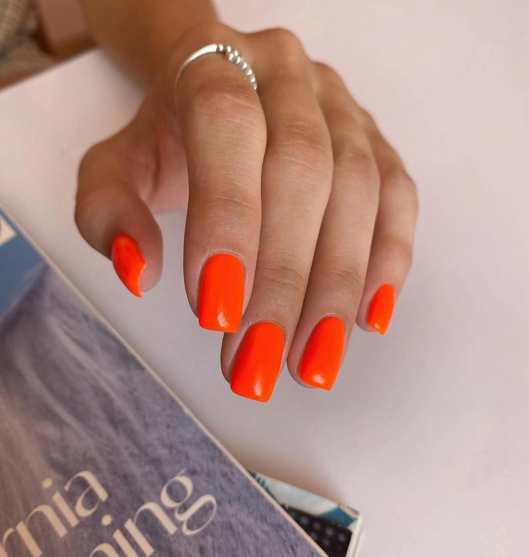 Bright orange glossy medium square nails