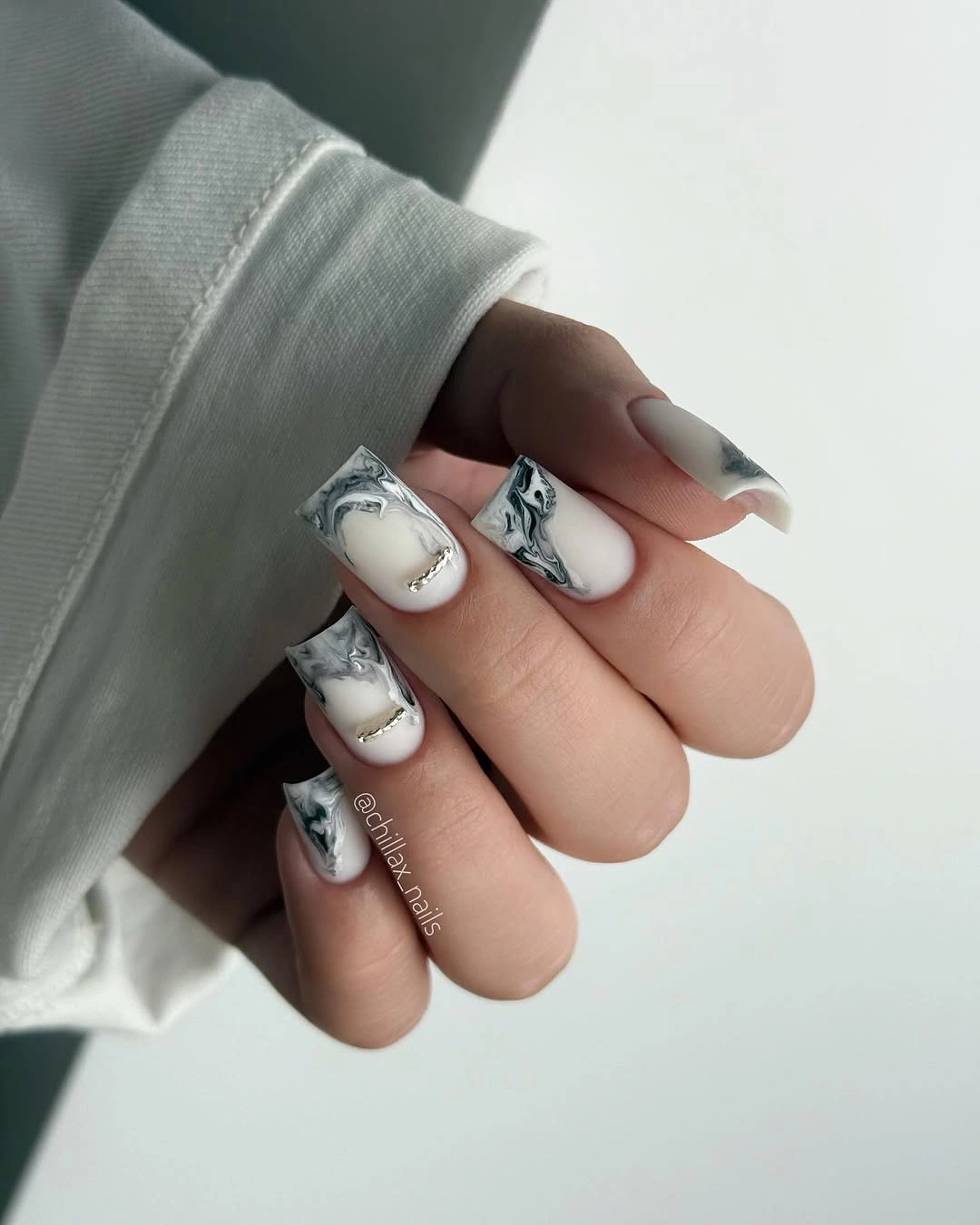 Square nails with smoky marble French panels and silver arcs