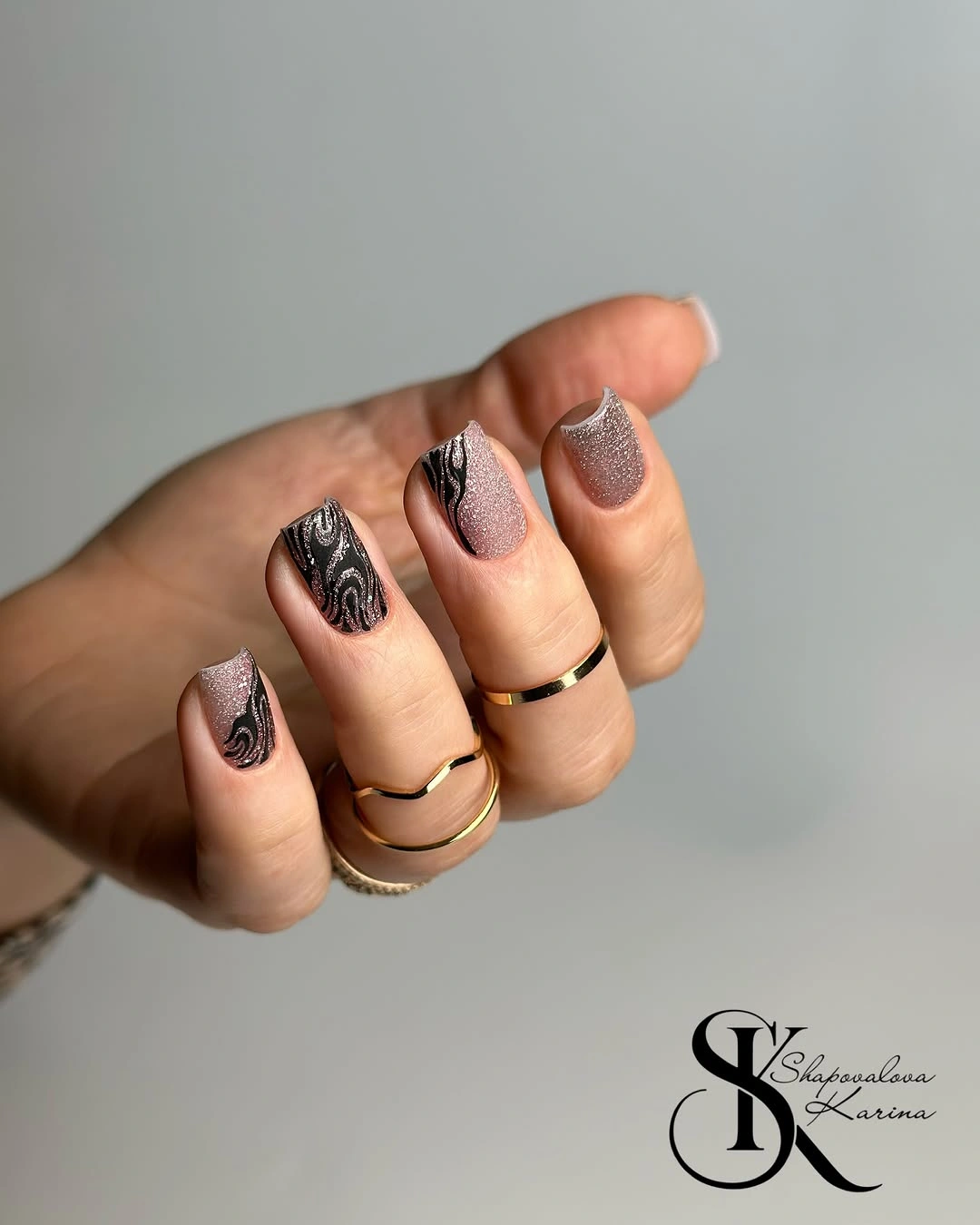 Rose glitter square nails with black swirl art