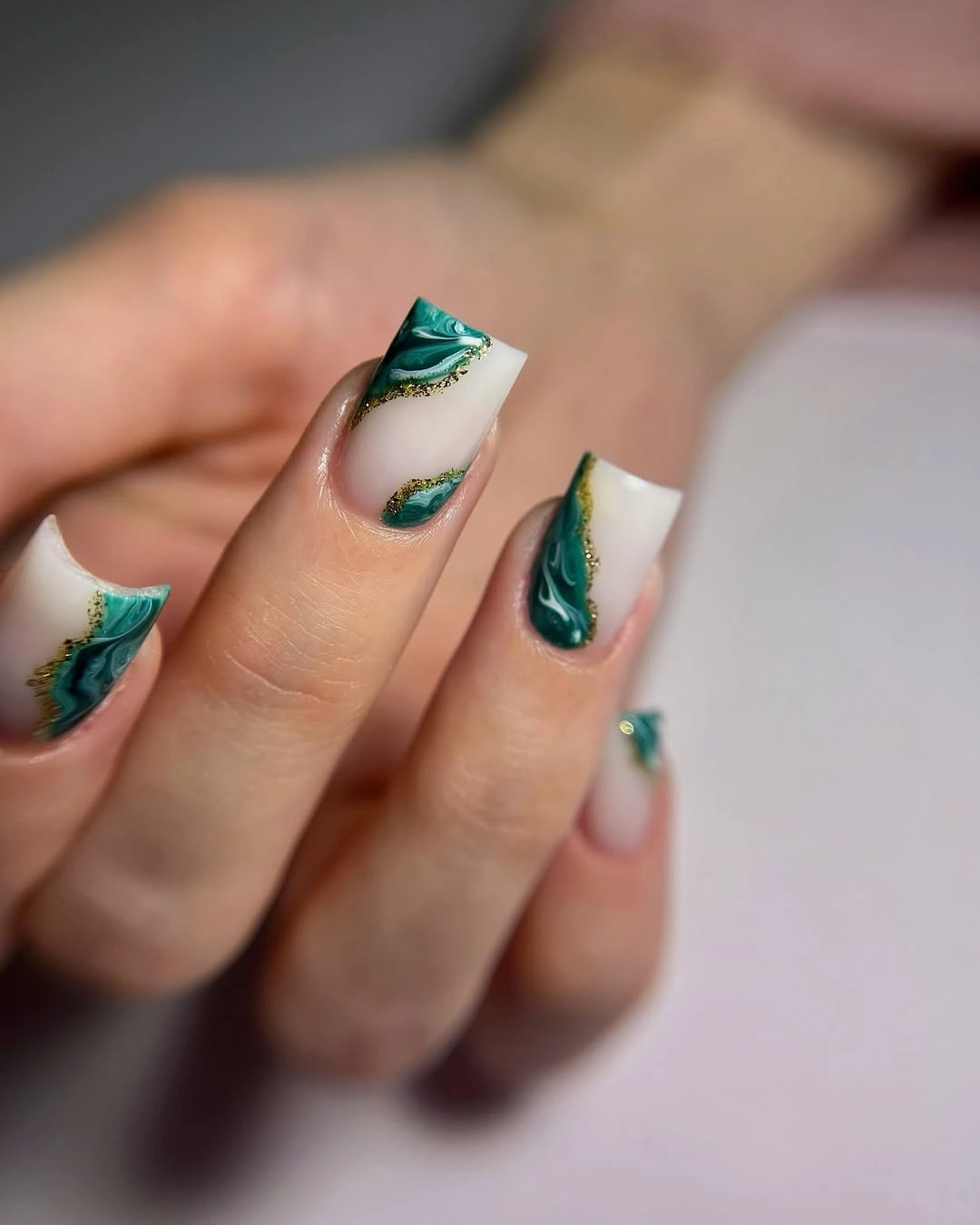 Square nails with emerald marble waves and gold borders