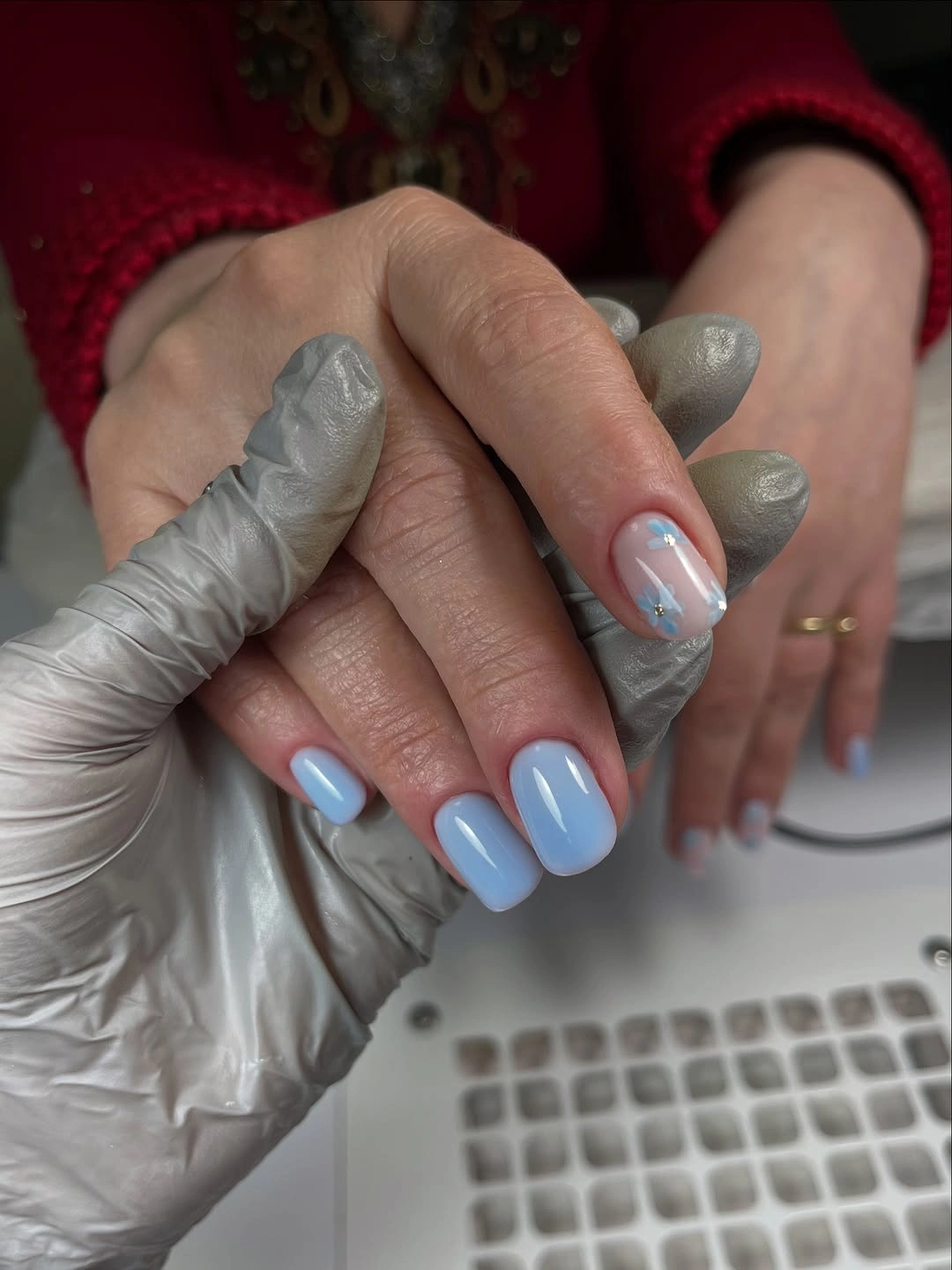 Short rounded baby blue nails with smooth glossy polish