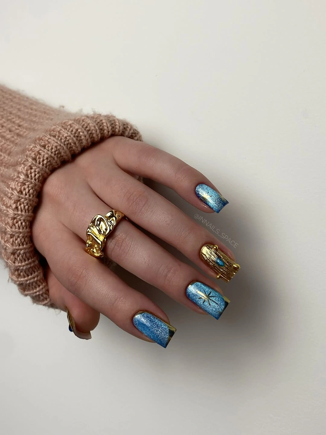 Short blue metallic square nails with gold accent frames