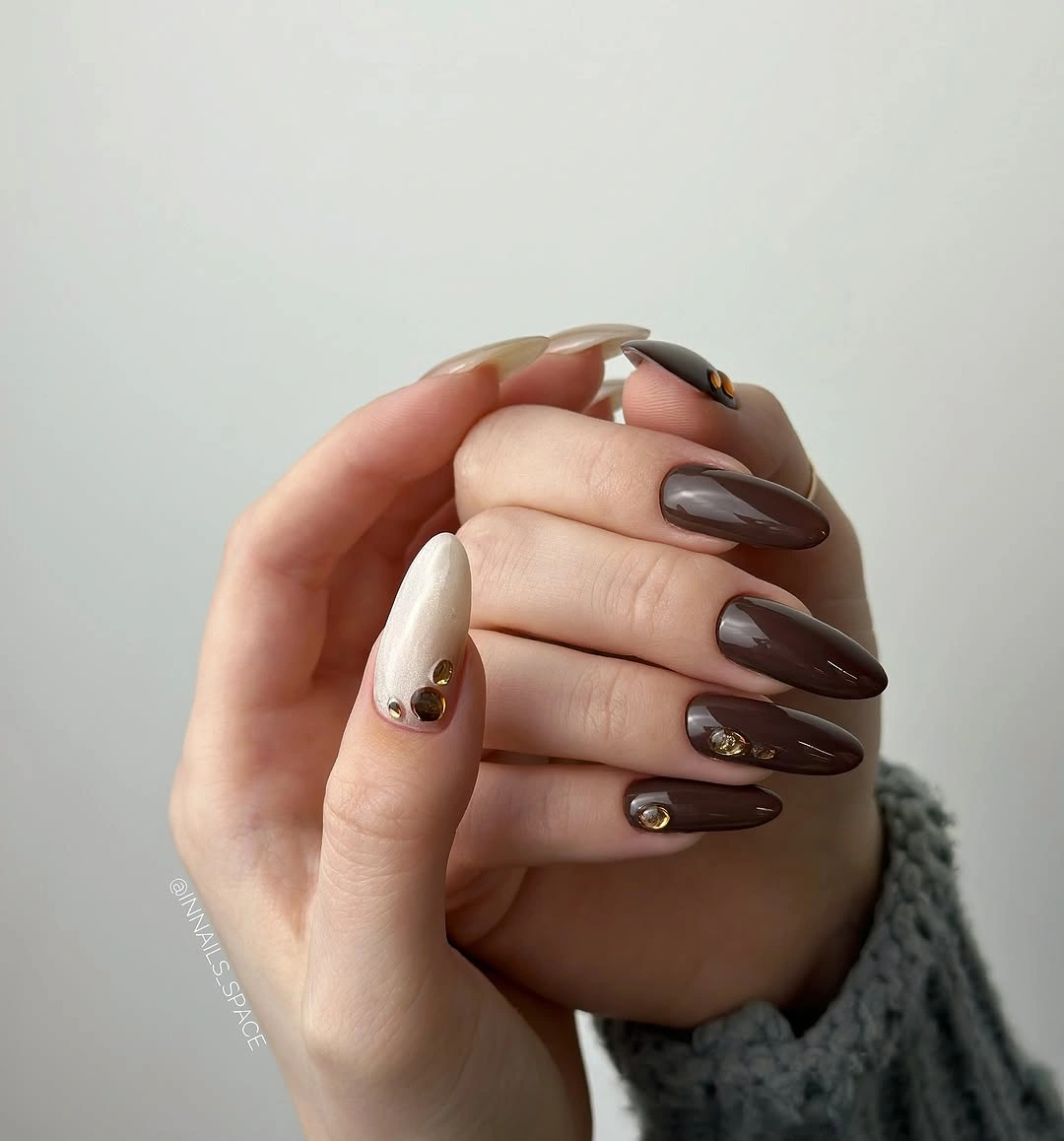 Brown and nude nails with tiny gold accent dots