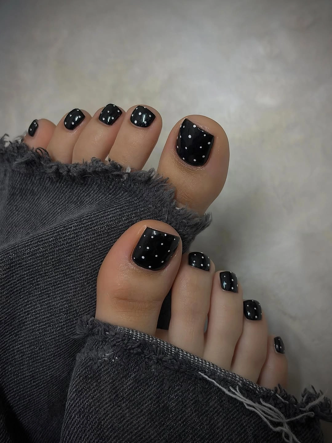 black toenails with small white dot accents