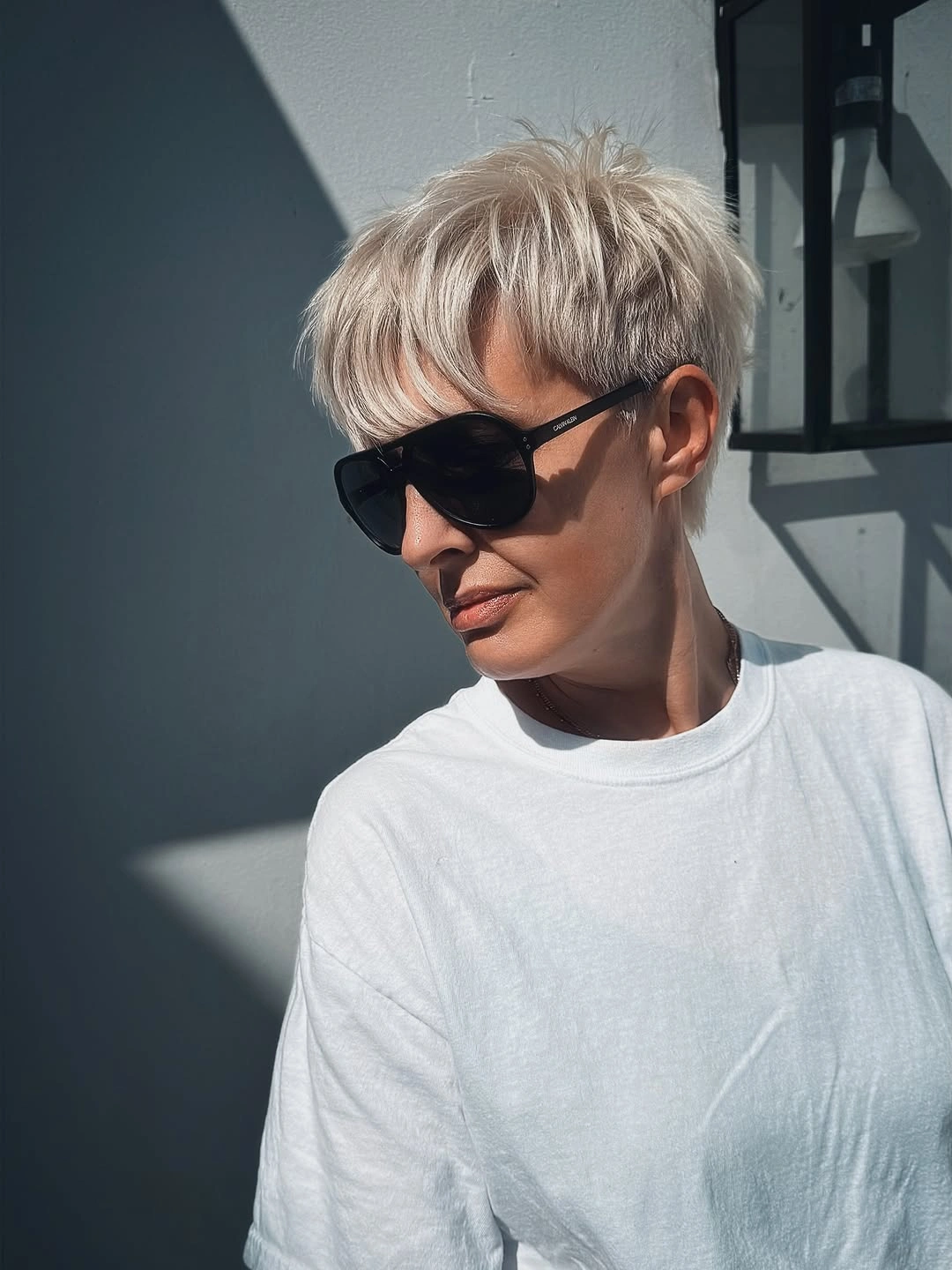 fall pixie haircut ideas 2026 Layered Platinum Pixie With Airy Volume