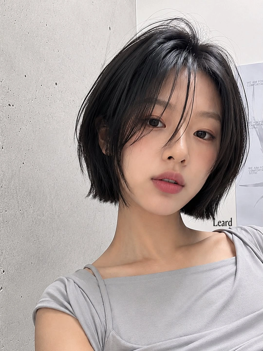 fall short haircuts 2026 Soft French Bob With Airy Curtain Fringe