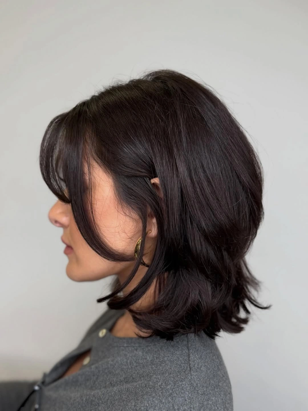 fall short haircuts 2026 Layered Butterfly Bob With Face-Framing Pieces