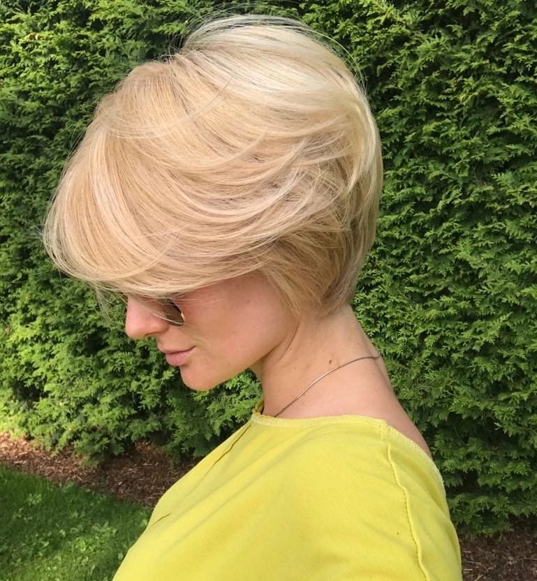 fall short haircuts 2026 Layered Blonde Pixie Bob With Dramatic Side Sweep