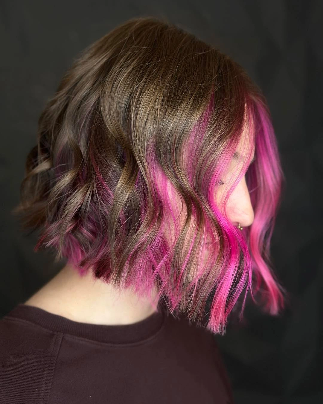 fall short haircuts 2026 Textured Wavy Bob With Vibrant Pink Accent Panels