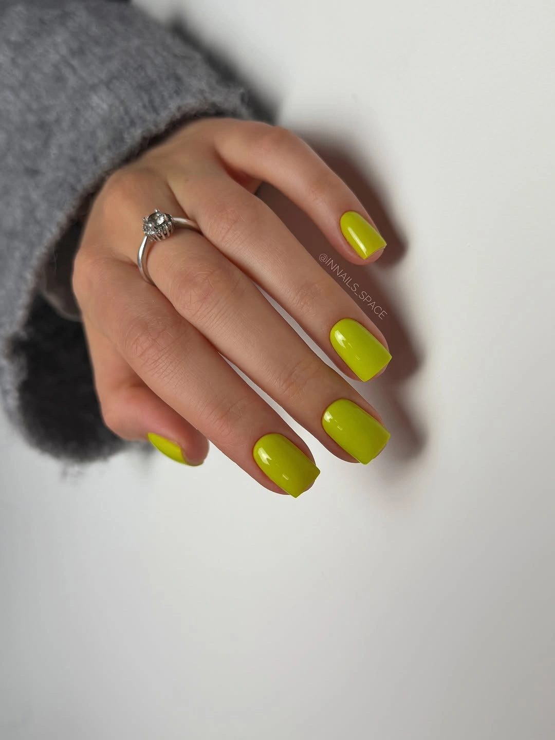lime green glossy polish on short square nails