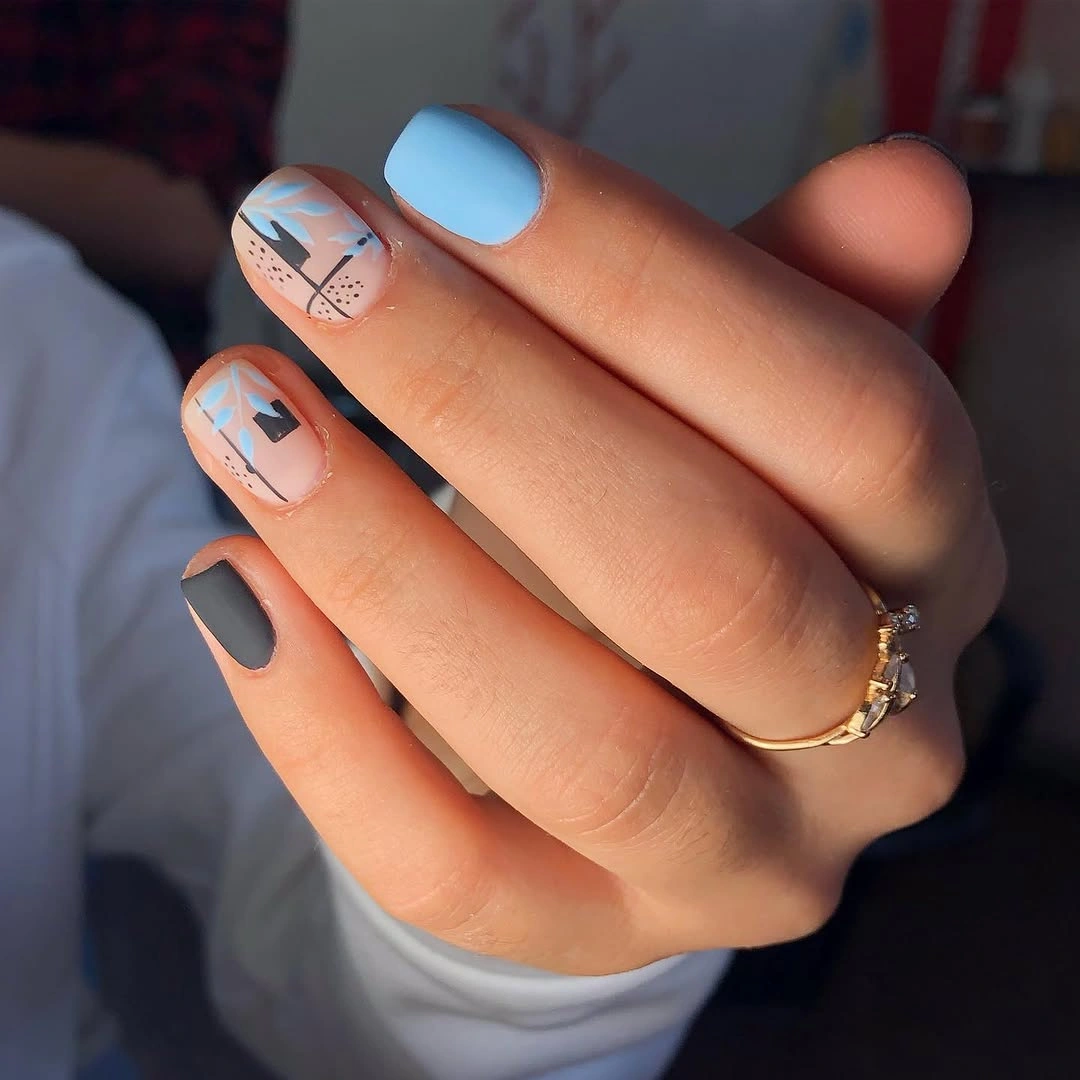 blue and gray short nails with abstract line art