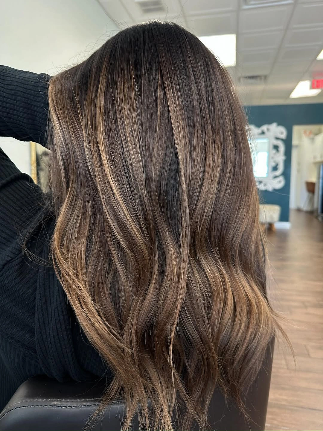 Hair Lowlights: Color Ideas and Inspiration Soft Cocoa Lowlights with Delicate Face-Framing Brightness