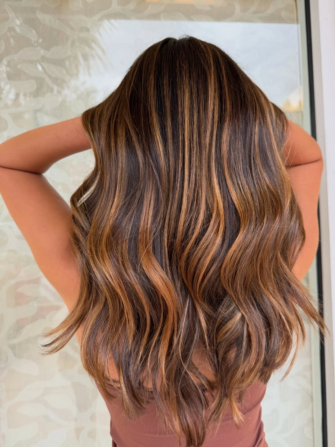 Hair Lowlights: Color Ideas and Inspiration Warm Cinnamon Lowlights for Lived-In Brunette Hair