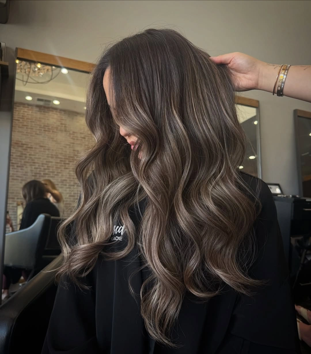 Hair Lowlights: Color Ideas and Inspiration Smoky Brunette Waves With Seamless Depth