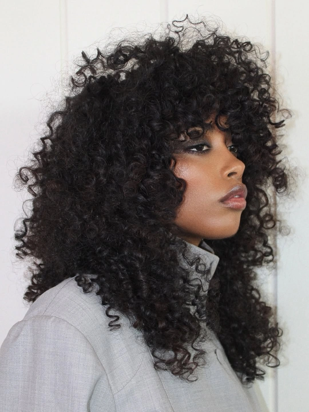 heatless curls hairstyle Cloud-Like Coils with Full Curly Bangs