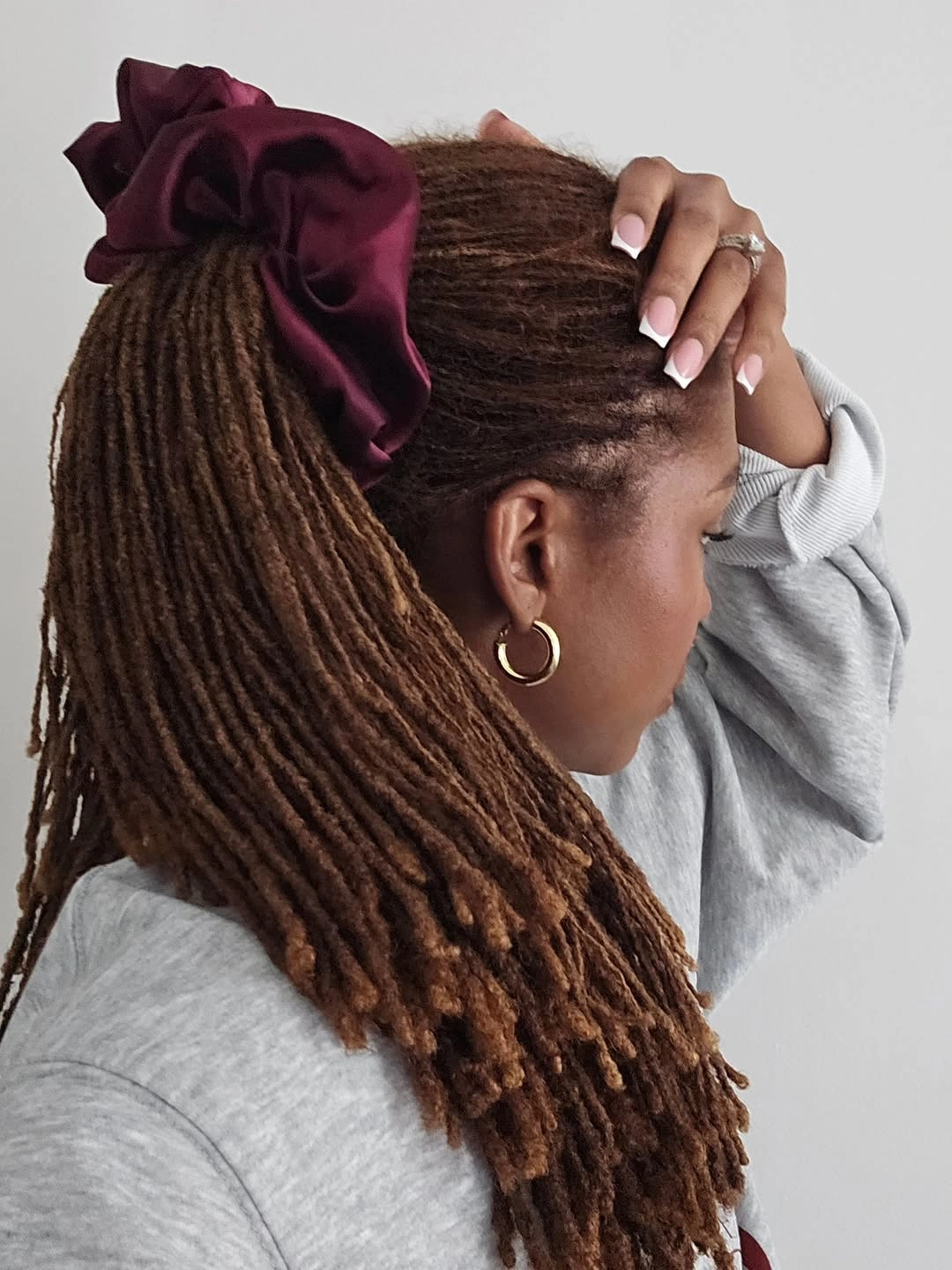 locs hairstyles for black women Low Ponytail Locs with a Romantic Satin Bow