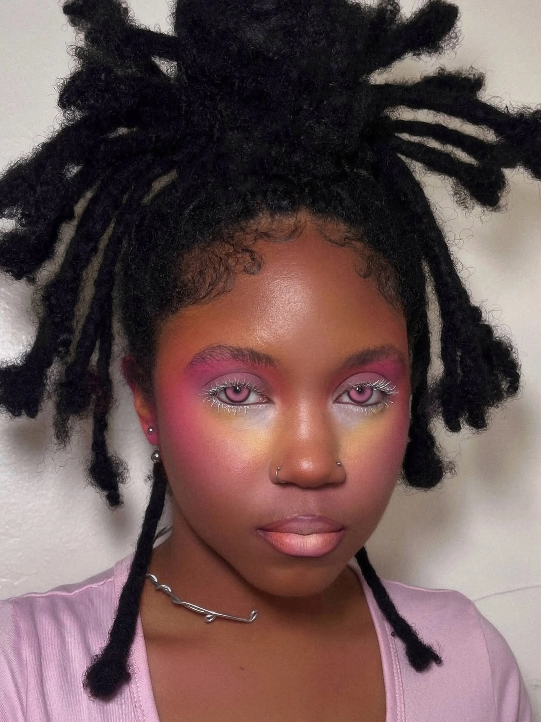locs hairstyles for black women Playful High Bun Locs with Artistic Energy