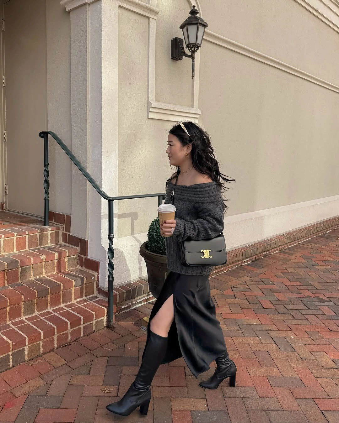 midi skirt fall outfit 2026 Black Satin Midi Skirt with an Off-Shoulder Knit for Effortless Evening Style