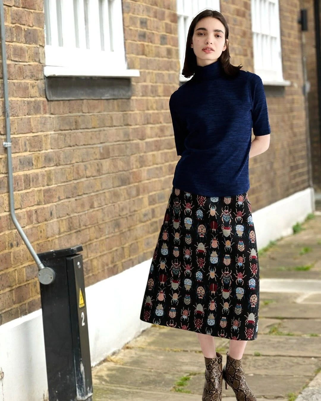 midi skirt fall outfit 2026 Artistic Patterned Midi Skirt with a Modern Navy Knit