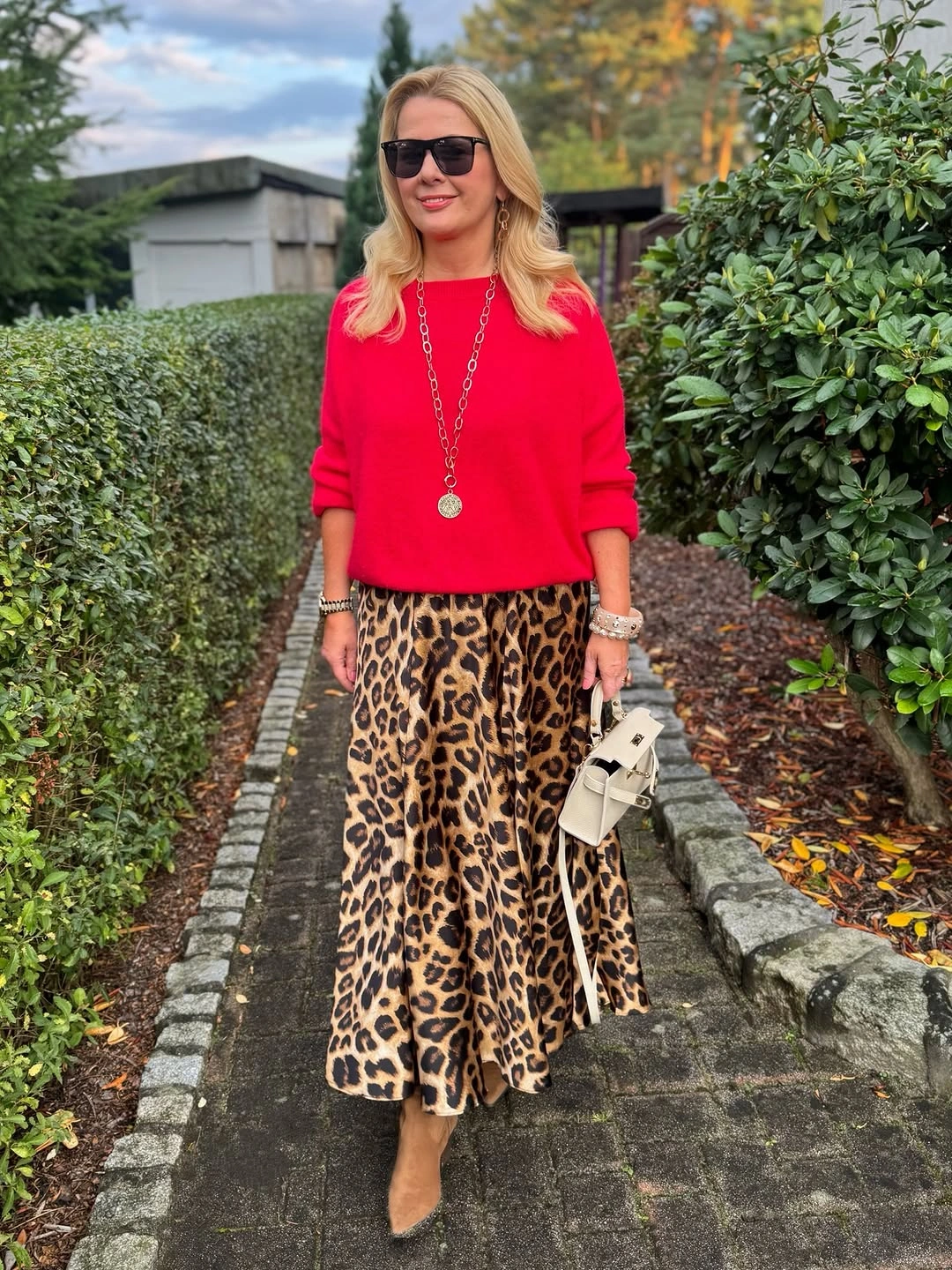 midi skirt fall outfit 2026 Bold Red Knit Meets a Leopard Midi Statement