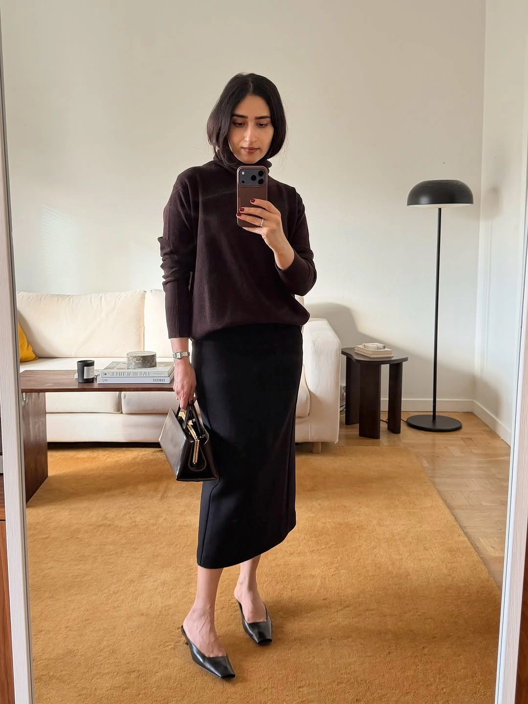 midi skirt fall outfit 2026 Chocolate Turtleneck with a Sleek Black Midi Silhouette