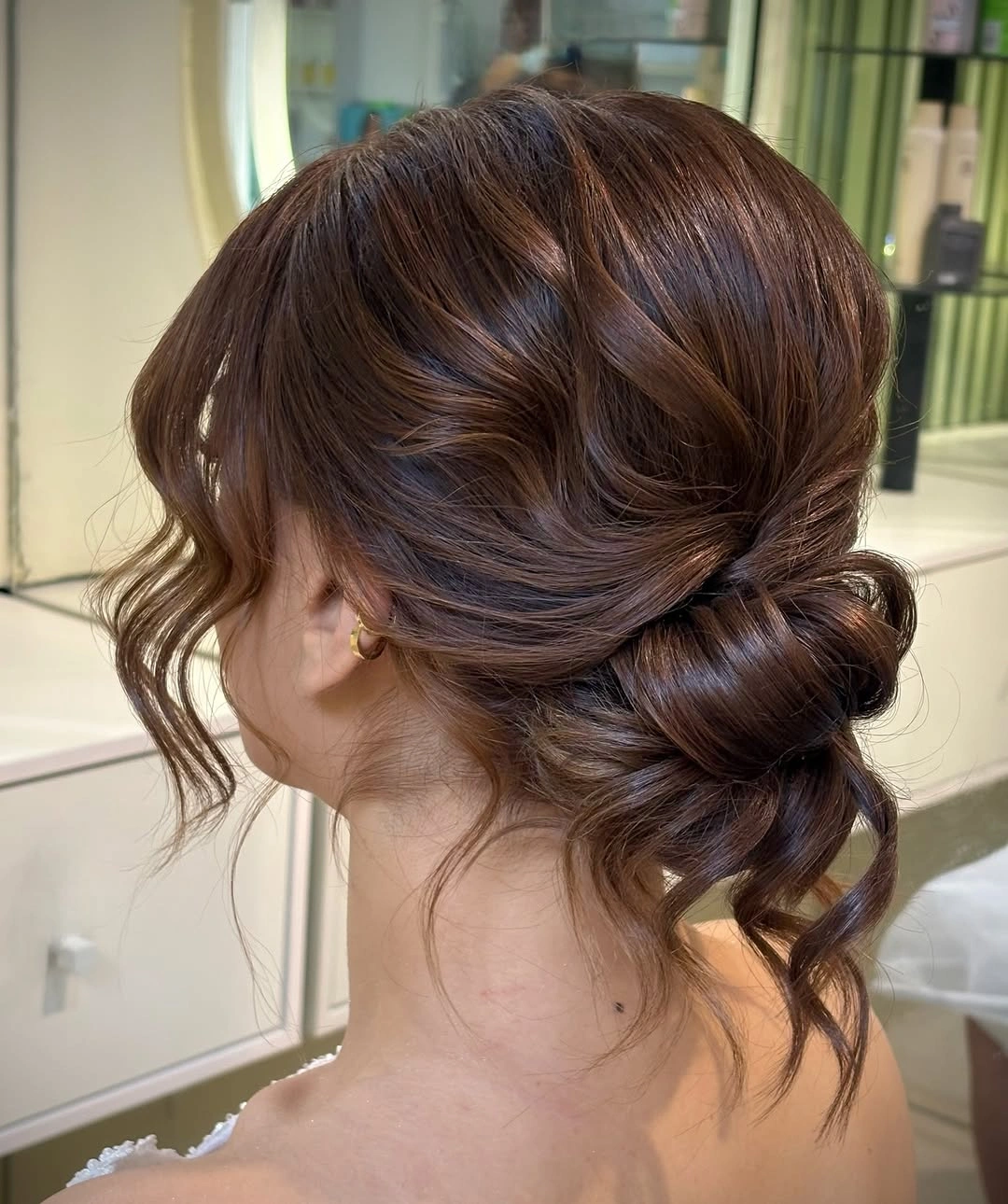 September hairstyles ideas 2026 Loose Low Updo With Face Tendrils