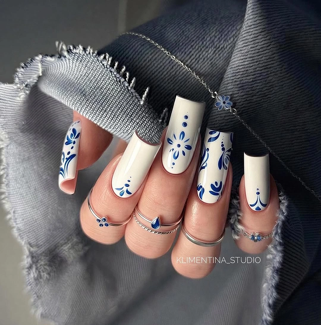 September nail art ideas 2026 Cream Squares With Blue Botanical Line Art