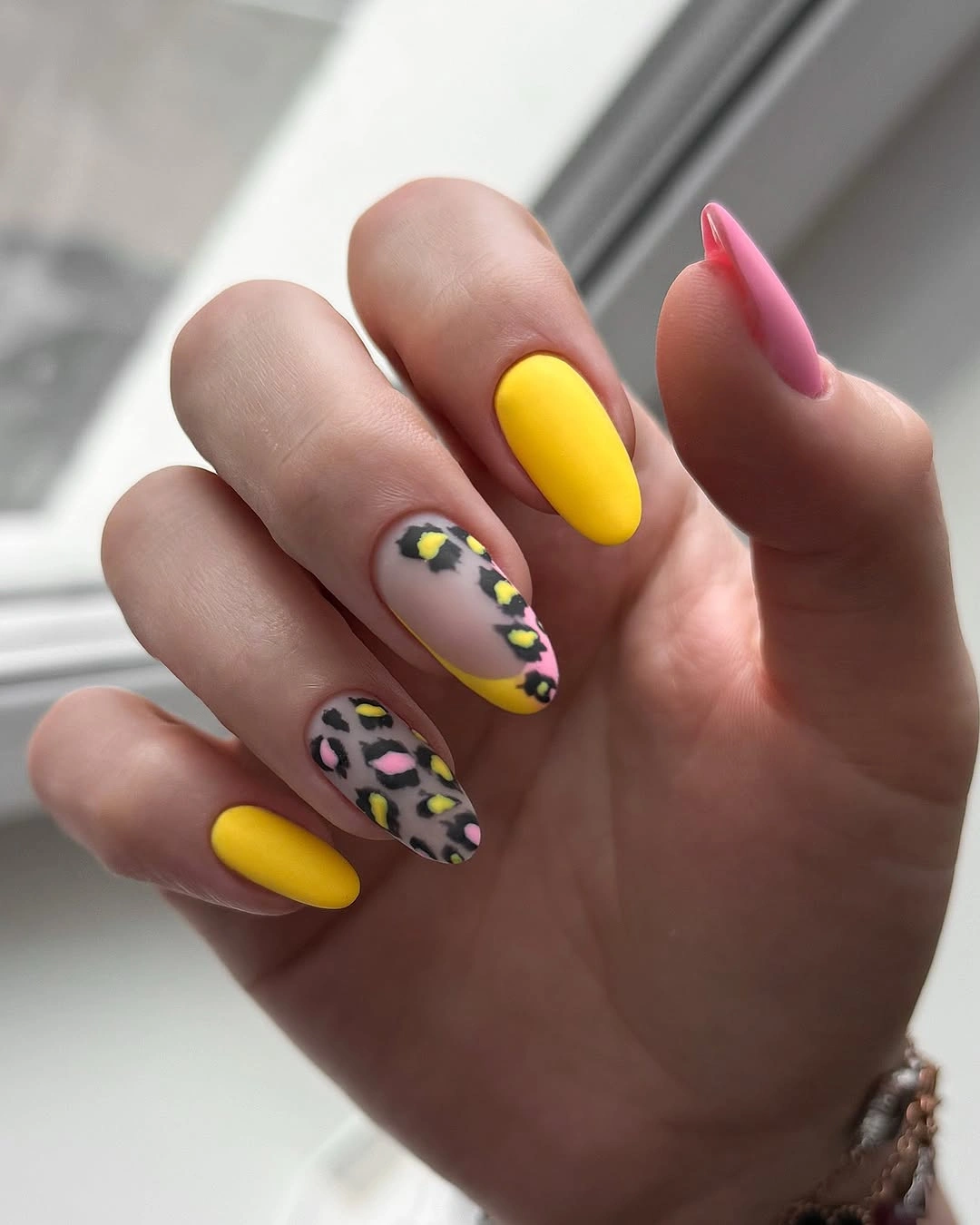 September nail art ideas 2026 Yellow And Pink Nails With Leopard Spot Accents