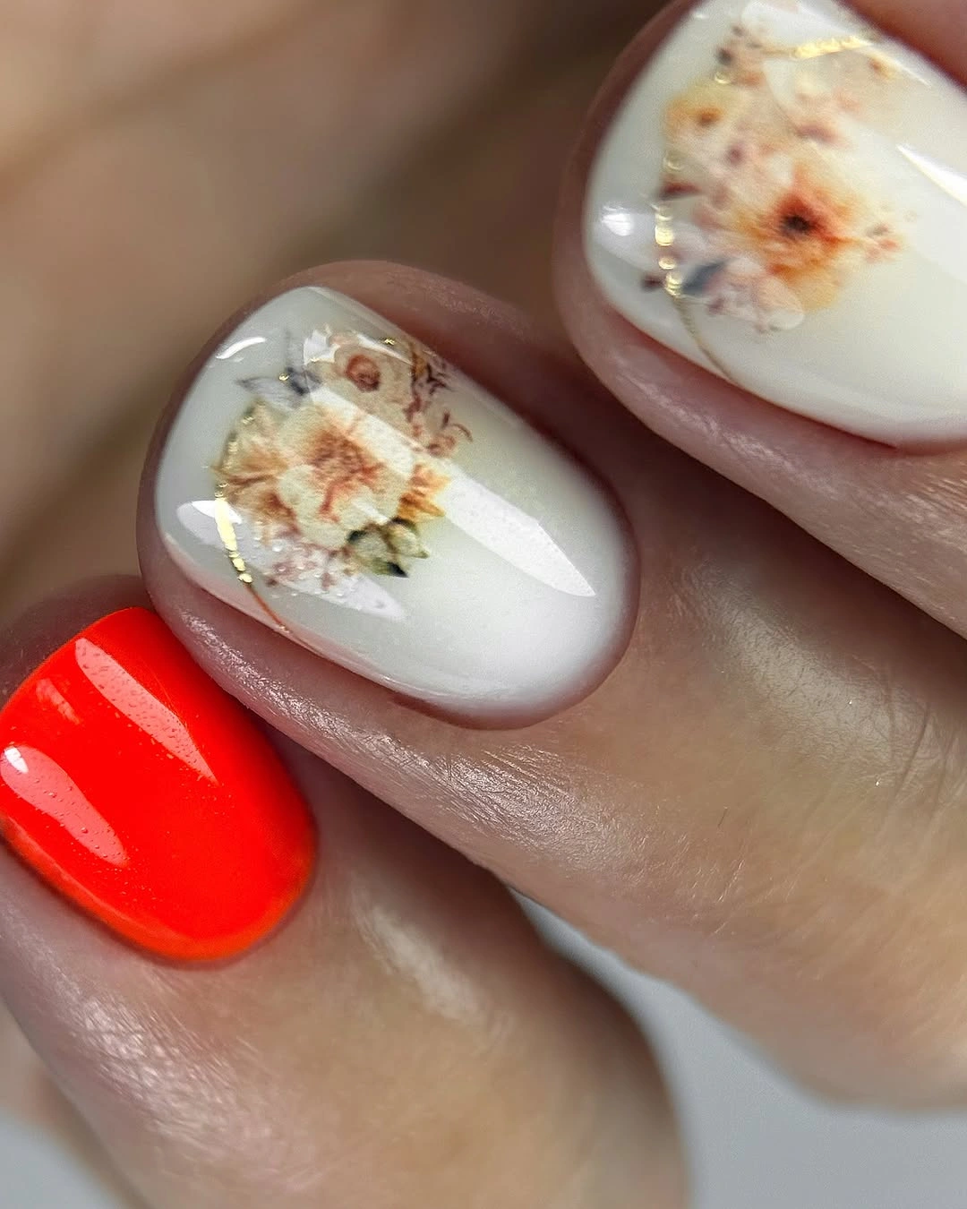 September nail art ideas 2026 Orange Red Nails With Milky Floral Accent