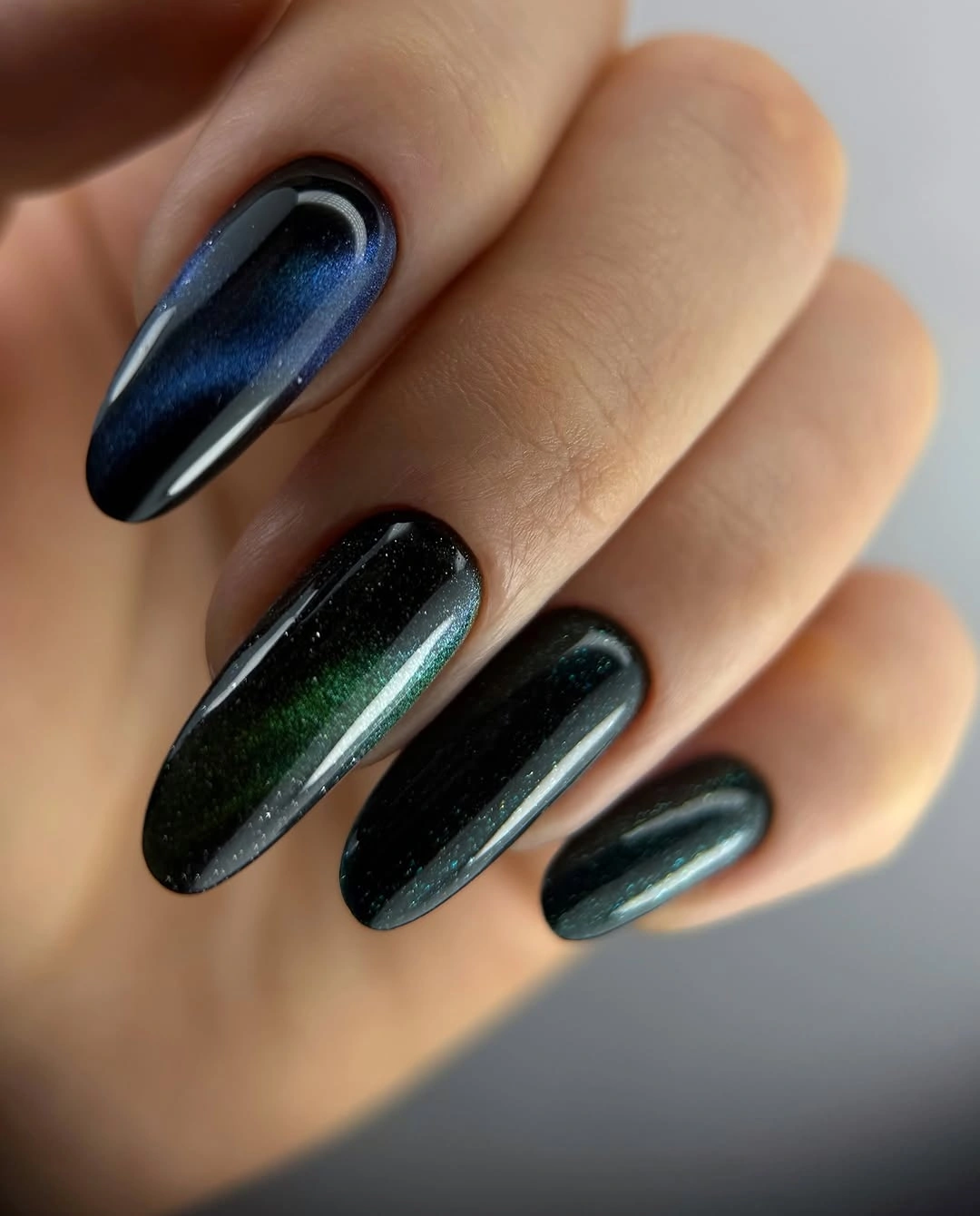 September nail art ideas 2026 Black Green Cat Eye Almond Nails