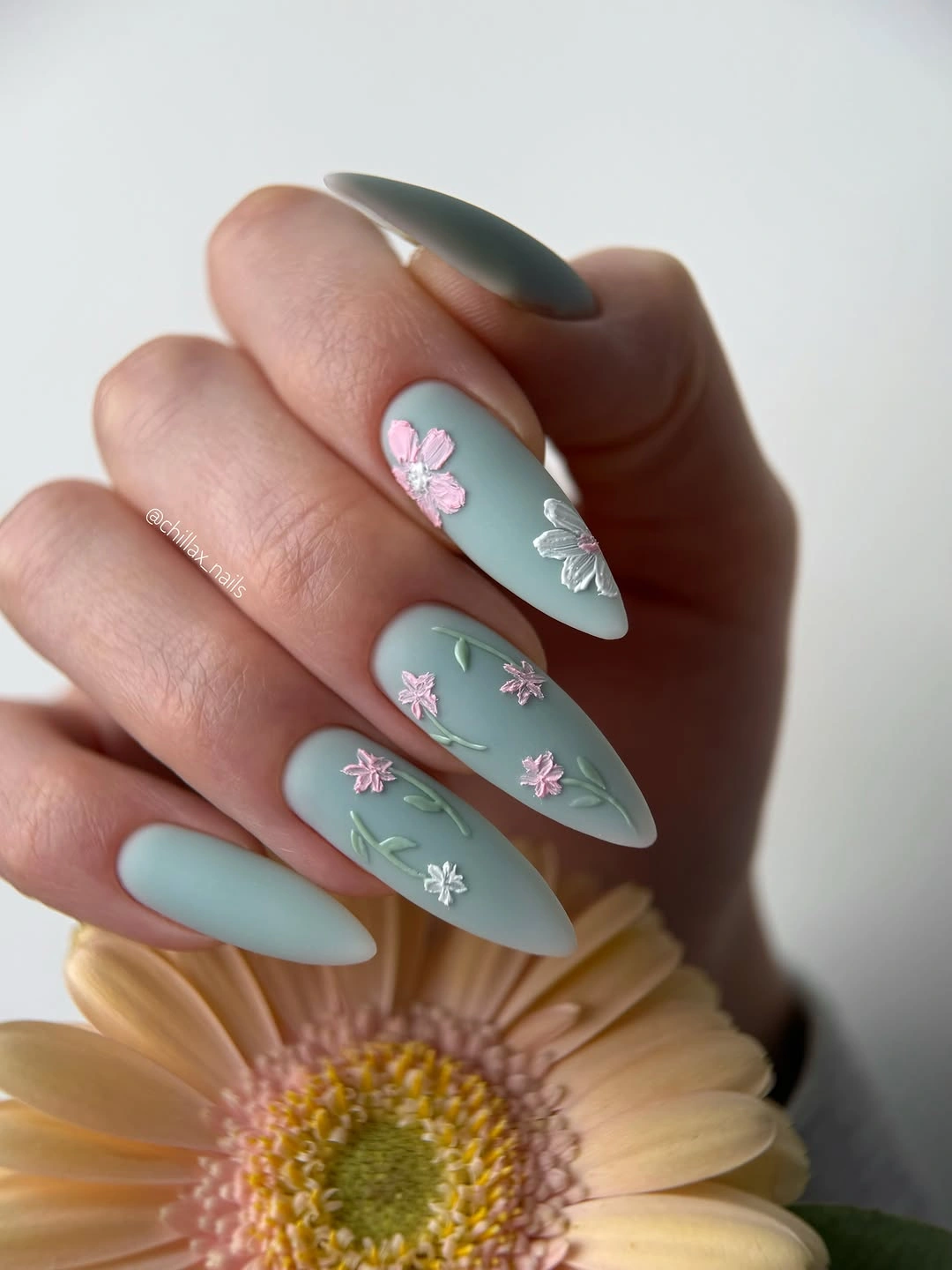 September nail art ideas 2026 Sage Almond Nails With White Daisy Accents