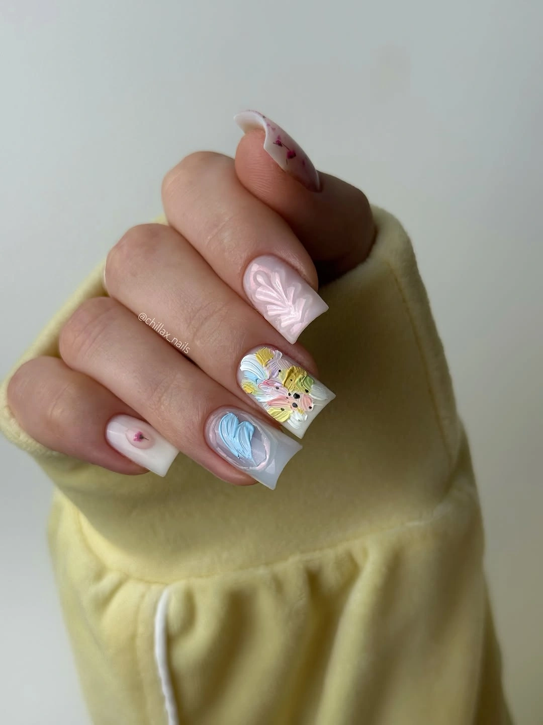 September nail art ideas 2026 Pastel Mixed Nails With Confetti And Swirl Details
