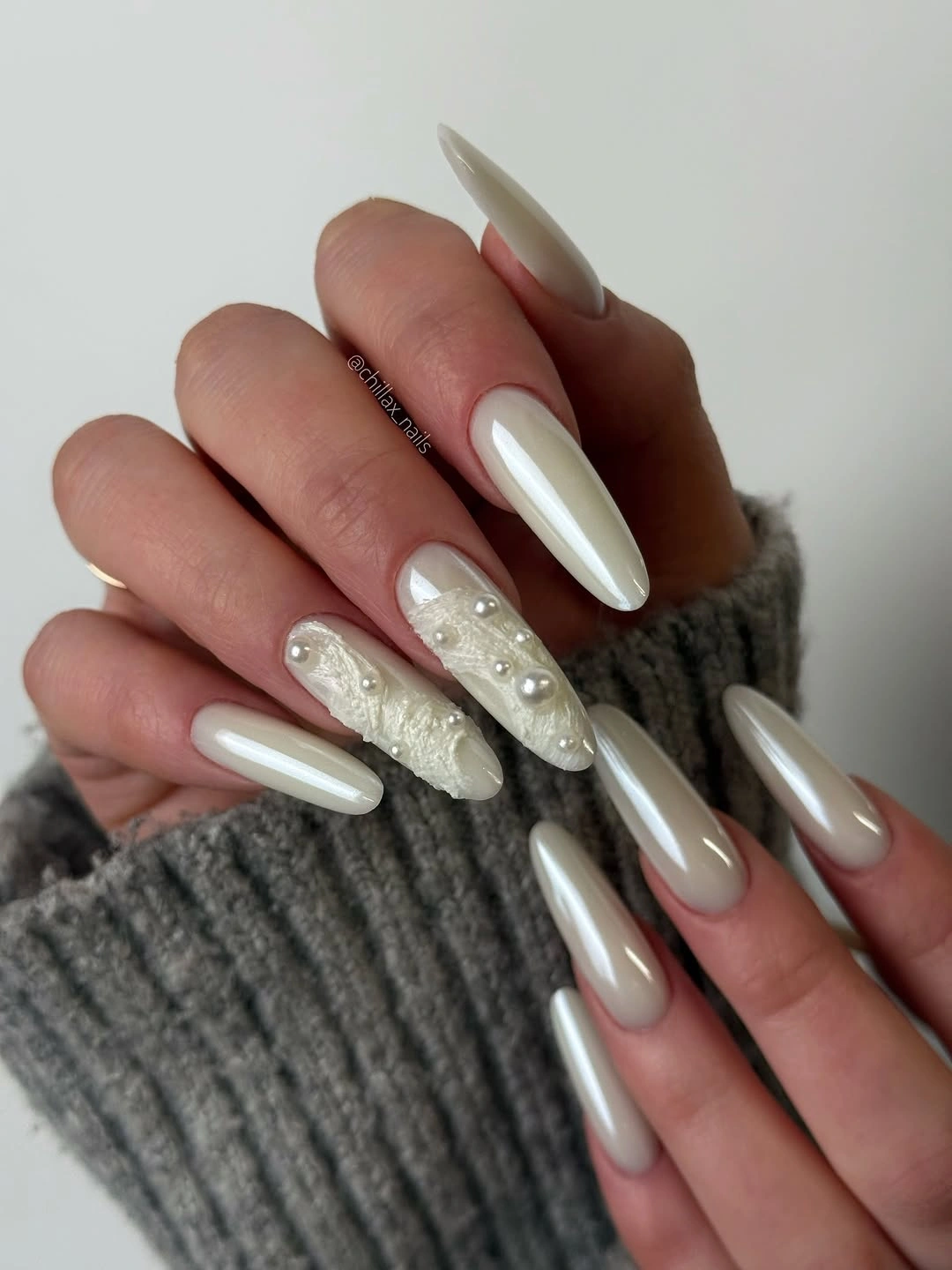 September nail designs 2026 Pearly White Almond Nails With Speckled Accent