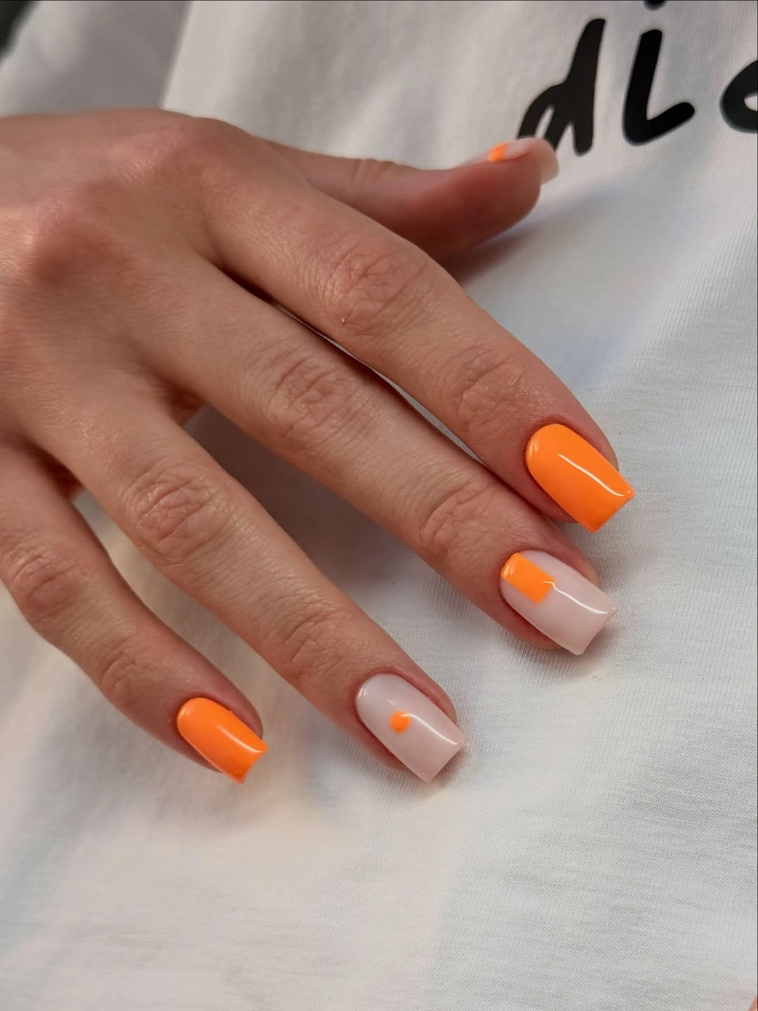 September nail designs 2026 Orange French Tips With Tiny Gold Stars