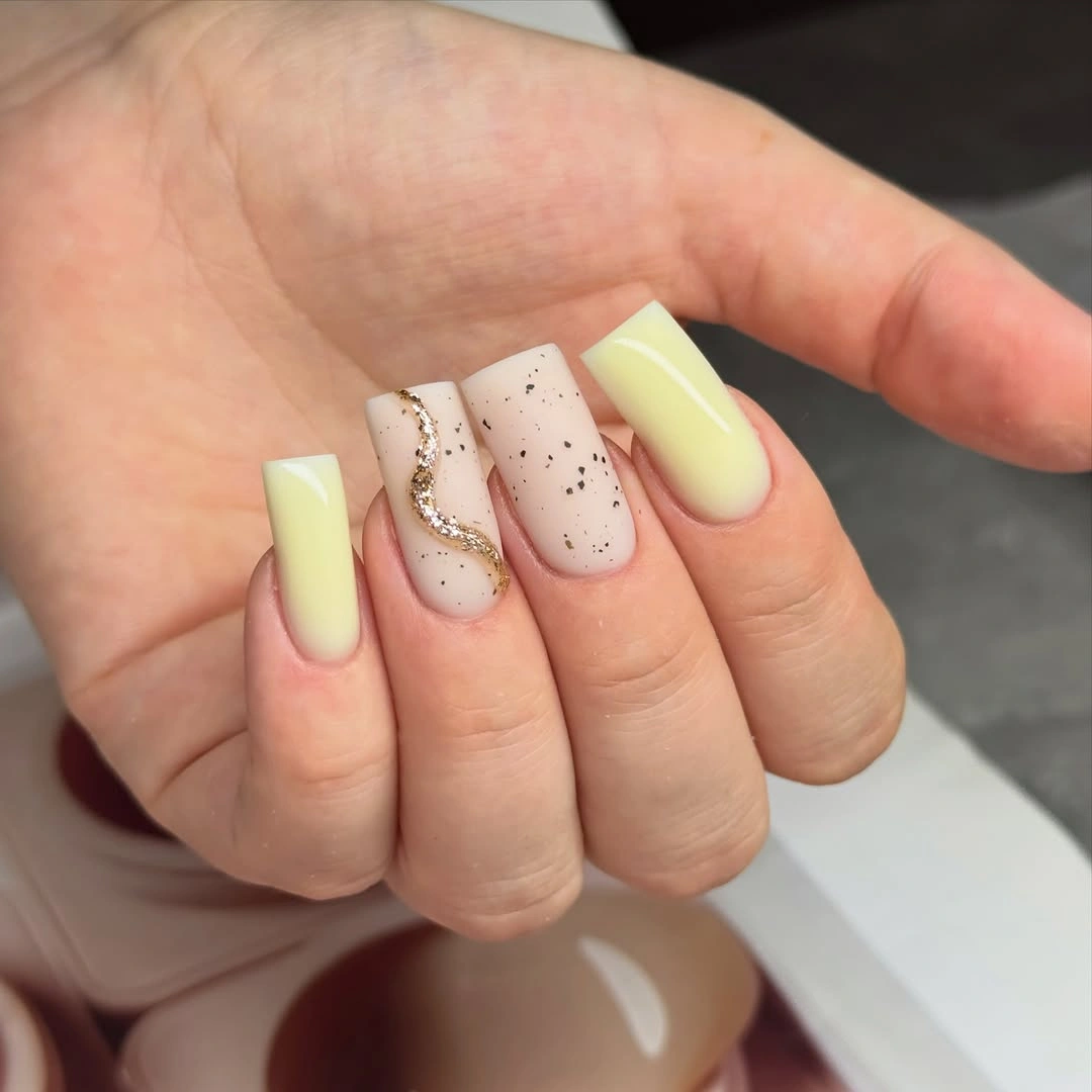 September nail designs 2026 Pale Yellow Squares With Speckled Pink Accent Nails