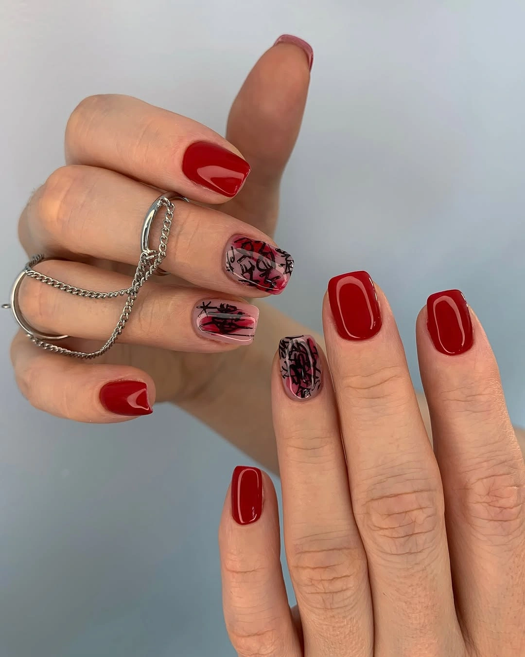 September nail designs 2026 Red Nails With Dark Leopard Accent Panels