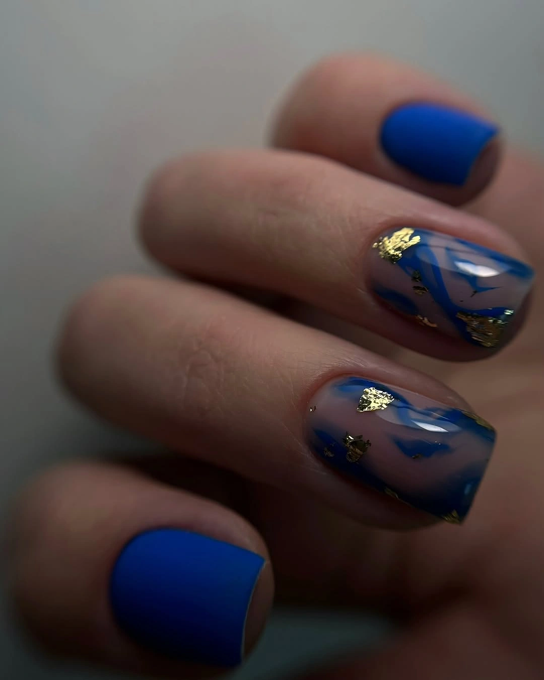 September nail designs 2026 Cobalt Blue Nails With Sheer Gold Foil Accents