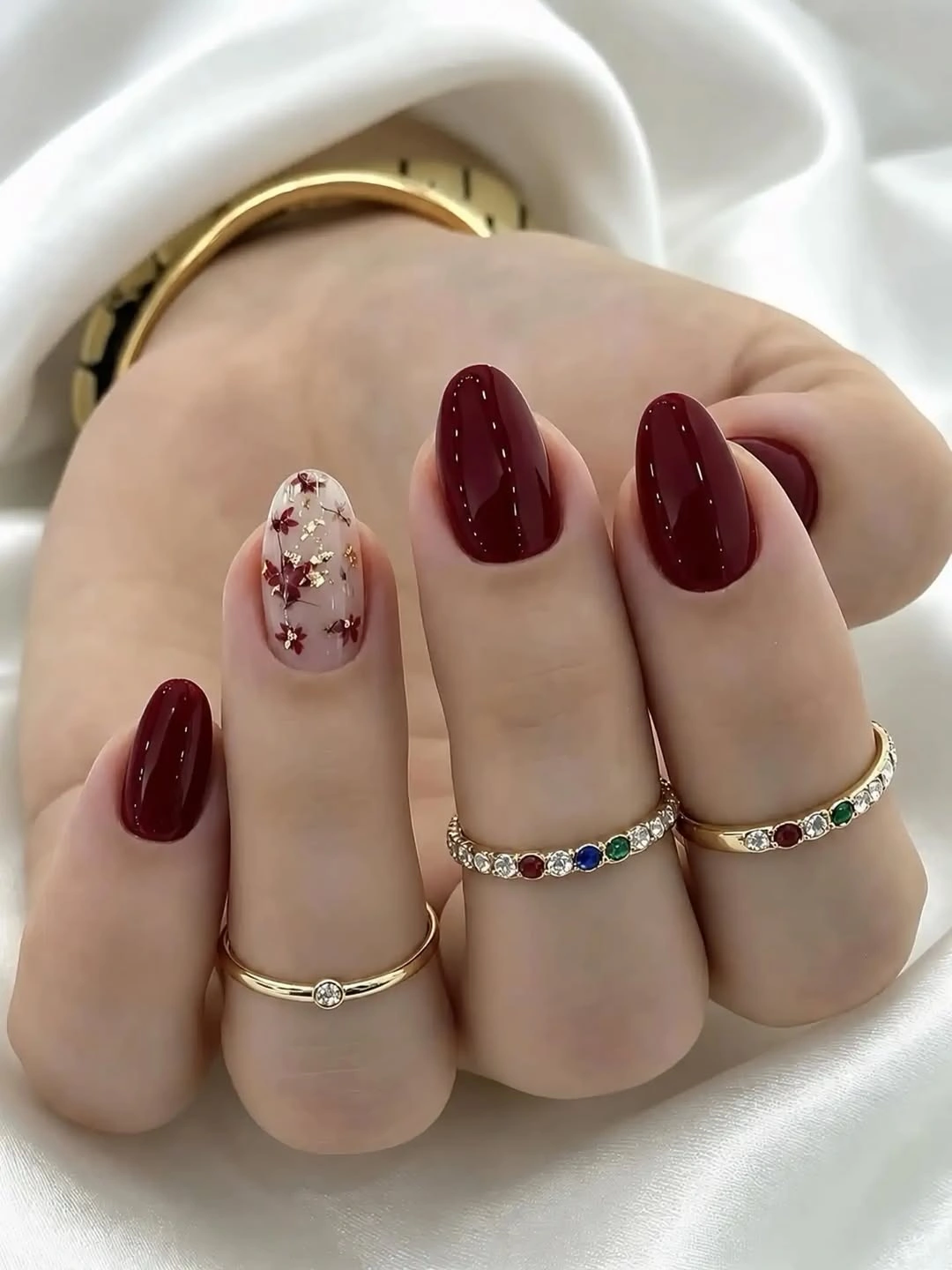 September nails color 2026 Burgundy Nails With A Tiny Floral Nude Accent