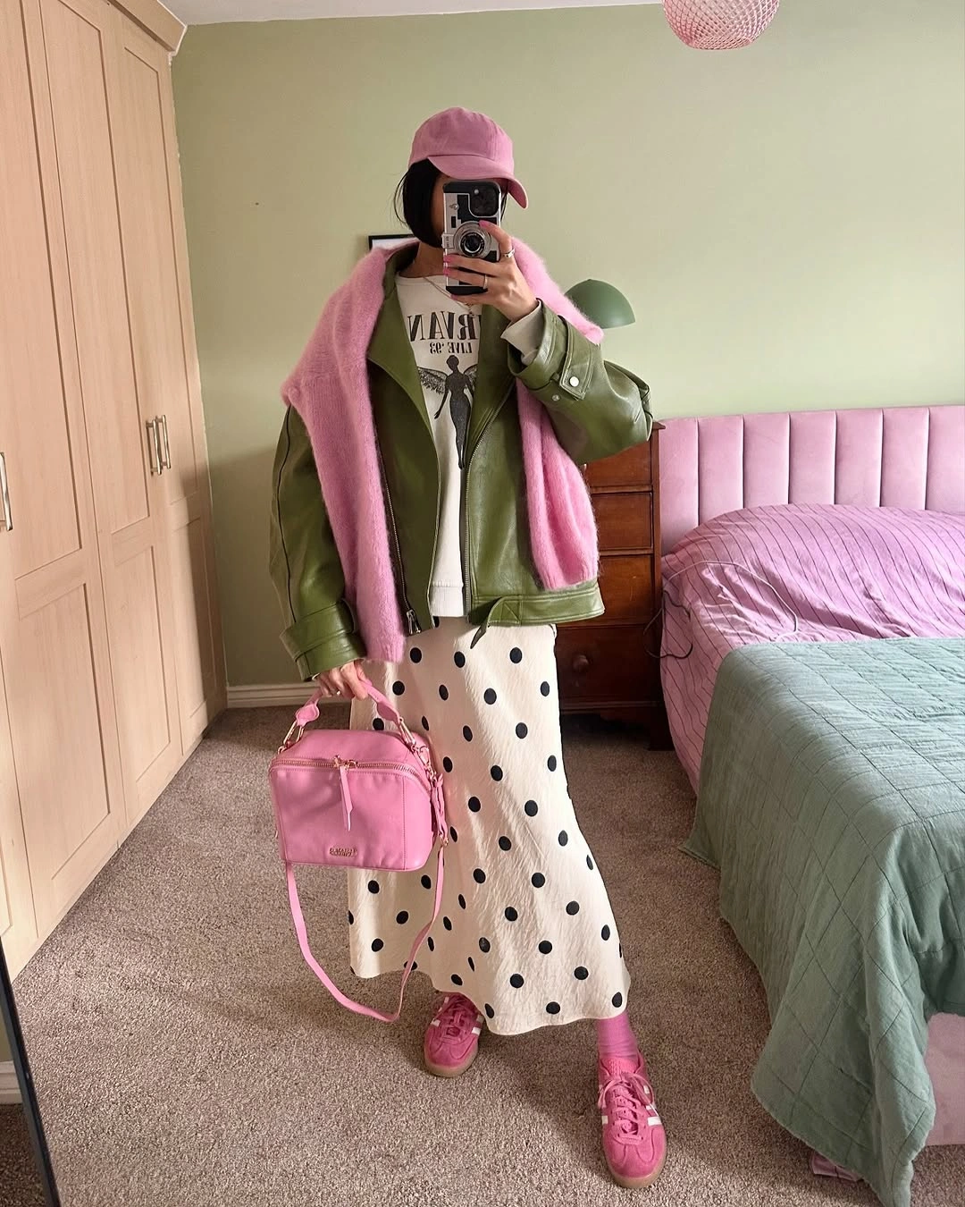 September outfits ideas 2026 Olive Jacket With Pink Scarf And Polka Dot Skirt