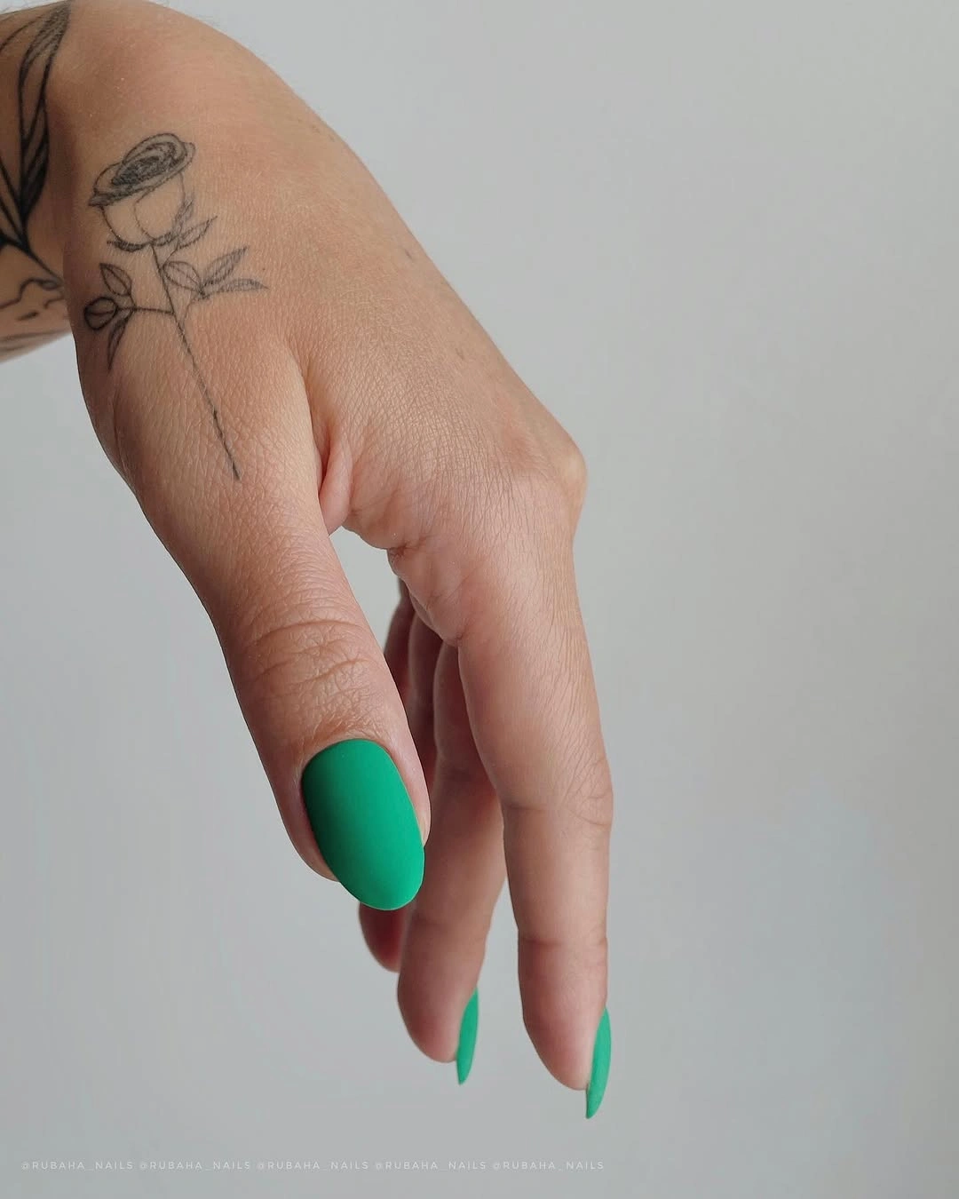 Bright green short rounded square nails with a glossy surface