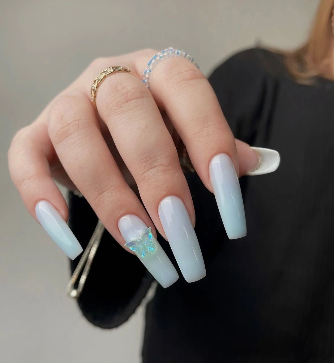 Long milky square nails with one pale blue accent detail