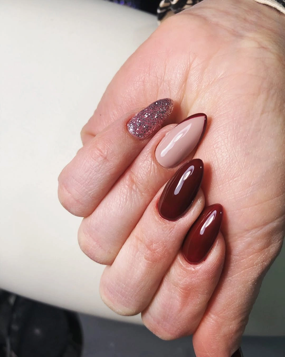 Long square nails mixing brown red brown and cream tones