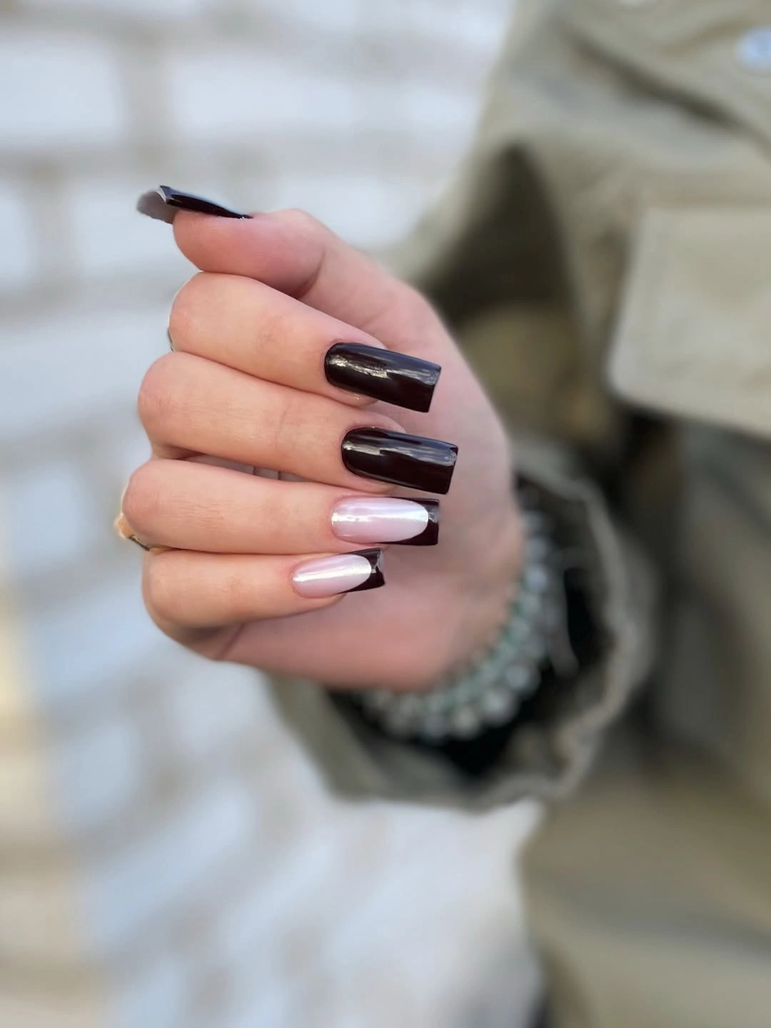 Medium brown square nails with one floral accent nail