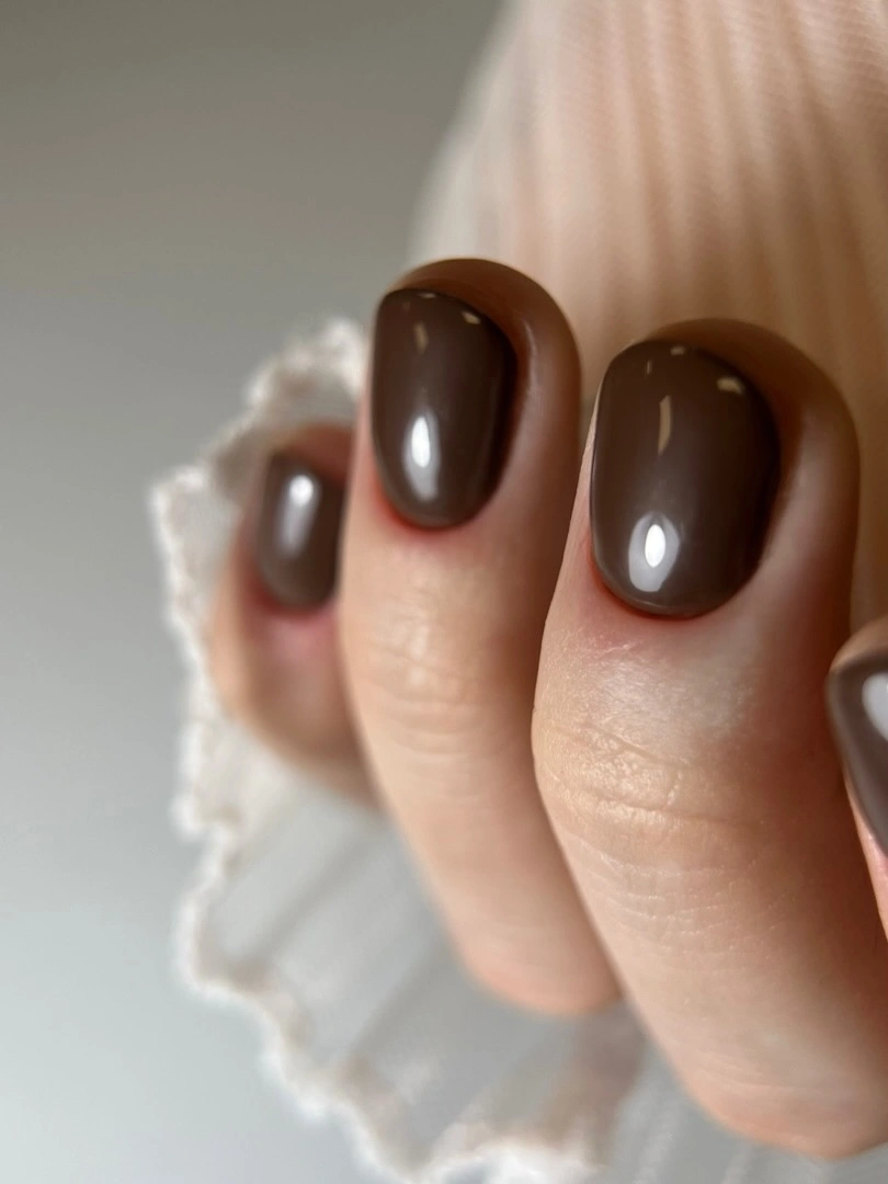 Long almond nails with chocolate burgundy and cream lines