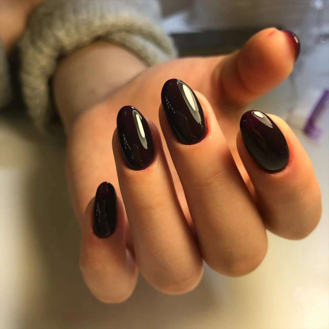 Medium almond nails in glossy espresso brown