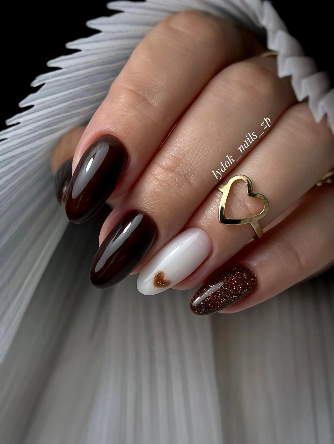 Brown almond nails with cream and glittered wine accents